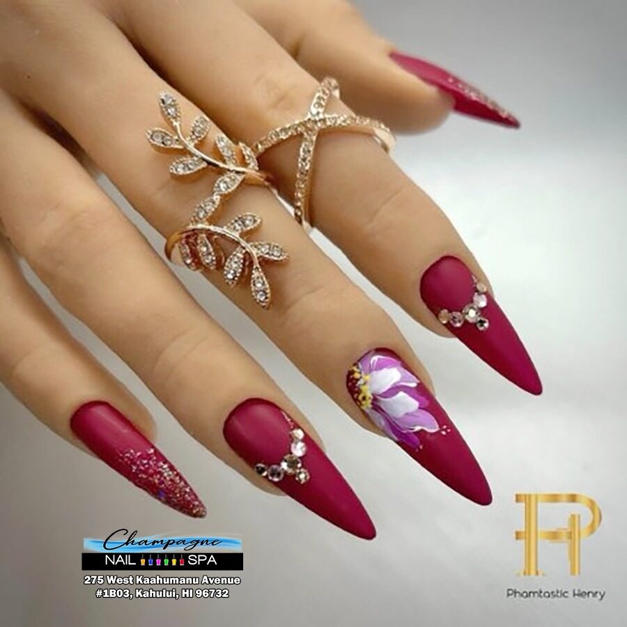 Burgundy stiletto nails with rhinestones at Gold Nails Maui, Kahului