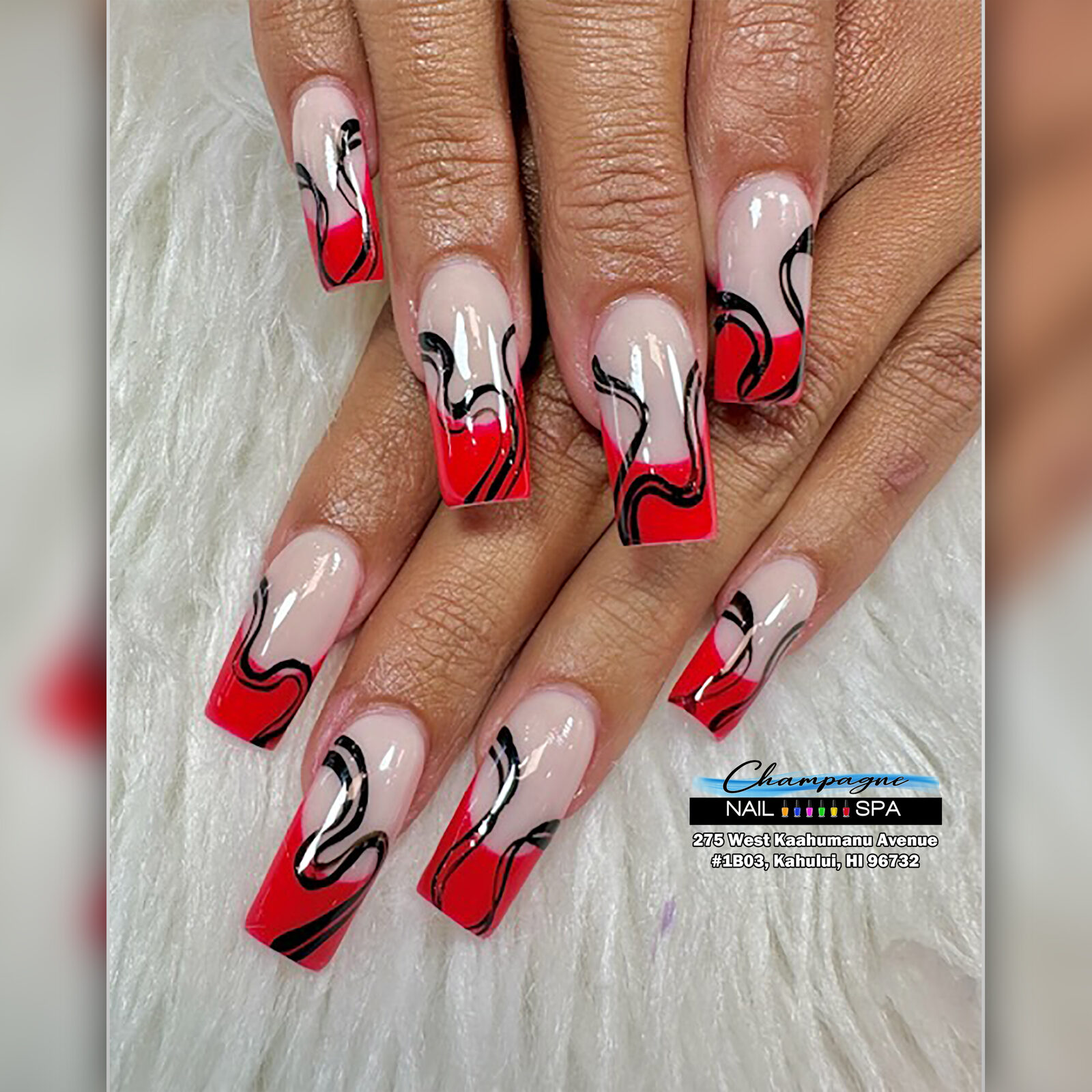 Red and black swirl nail art at Gold Nails Maui, Kahului